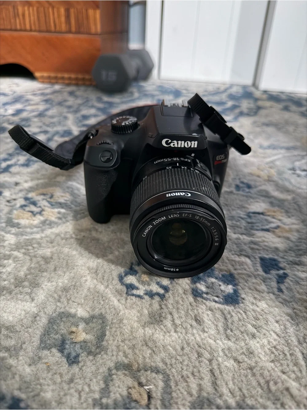 Canon EOS RebelT100 DSLR Camera with Kit Zoom Lens and Red-Trim Strap